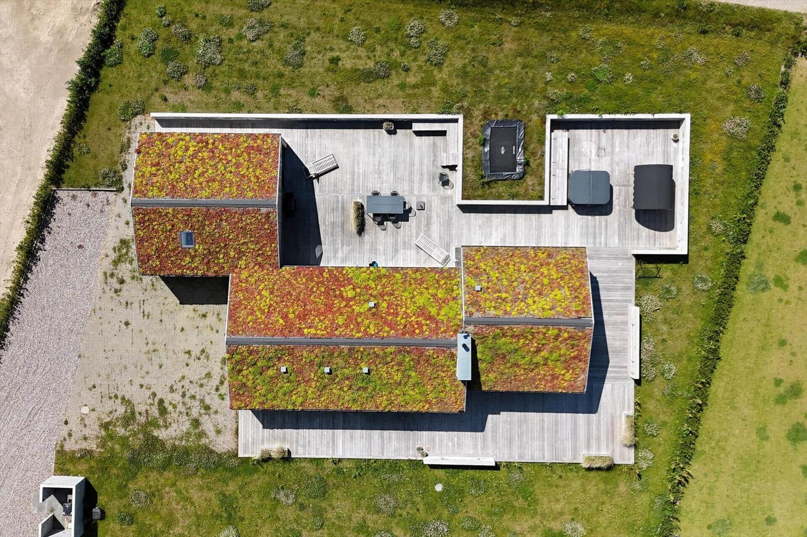 Symbolerklärung für Ferienhausgrundrisse mit Raumbezeichnungen und Möbeln.