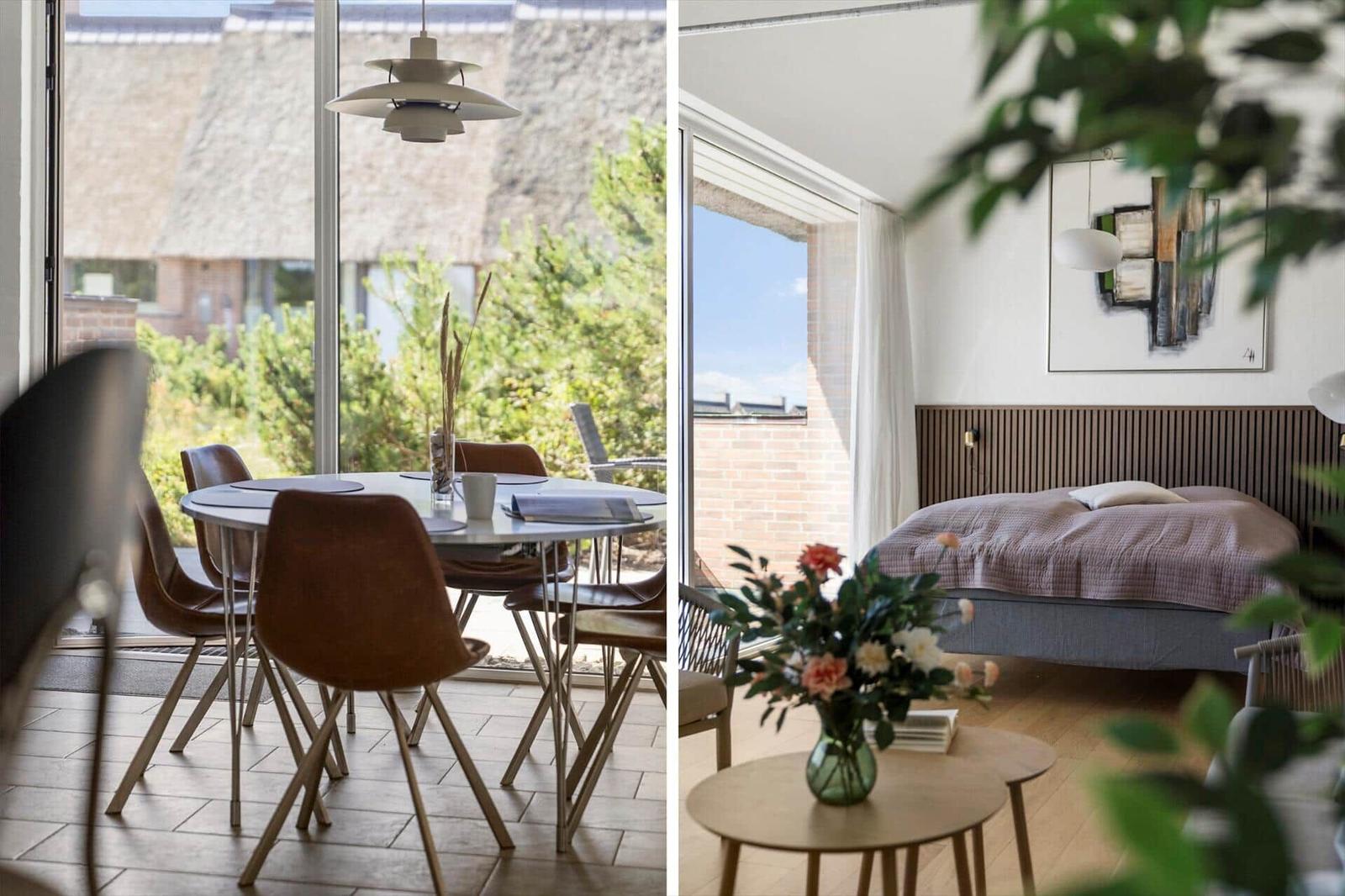 Esszimmer mit Tisch, Stühlen und TV. Durchgang zur Terrasse mit Blick auf Grünflächen.