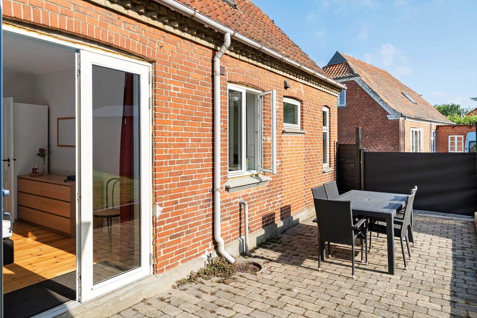 Hilly landscape by the sea with beach and forest