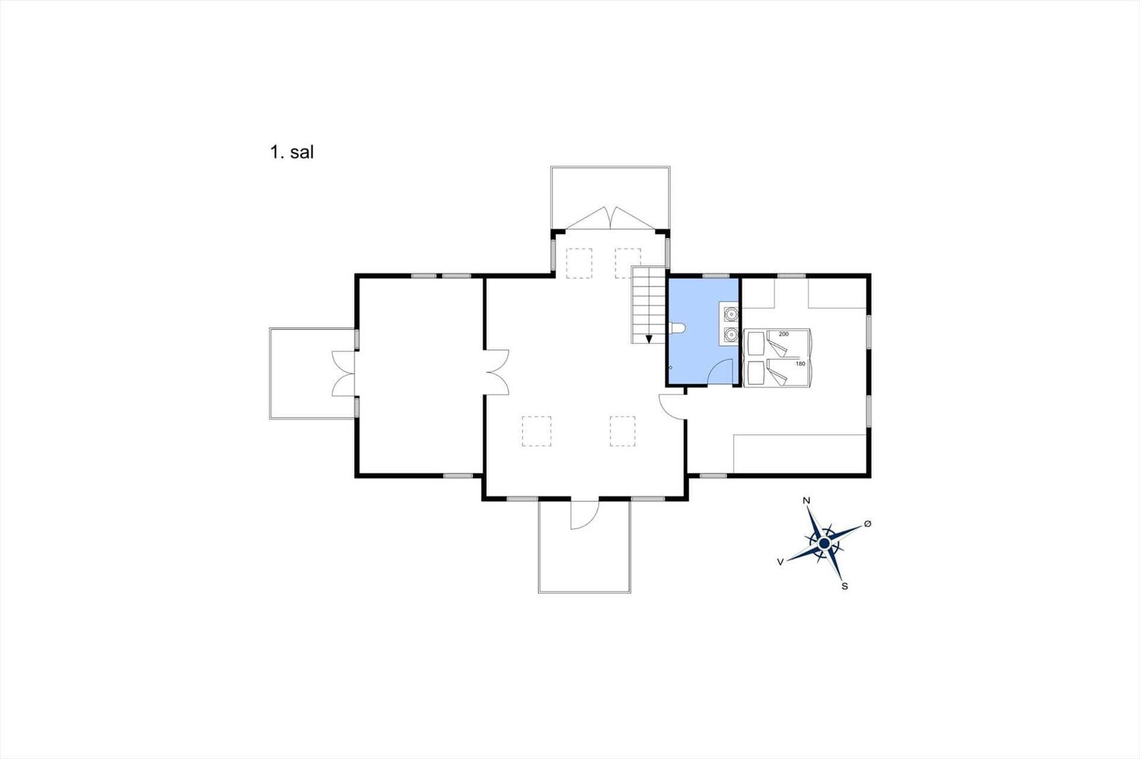 Living area with sofa, chairs, and TV under high ceiling