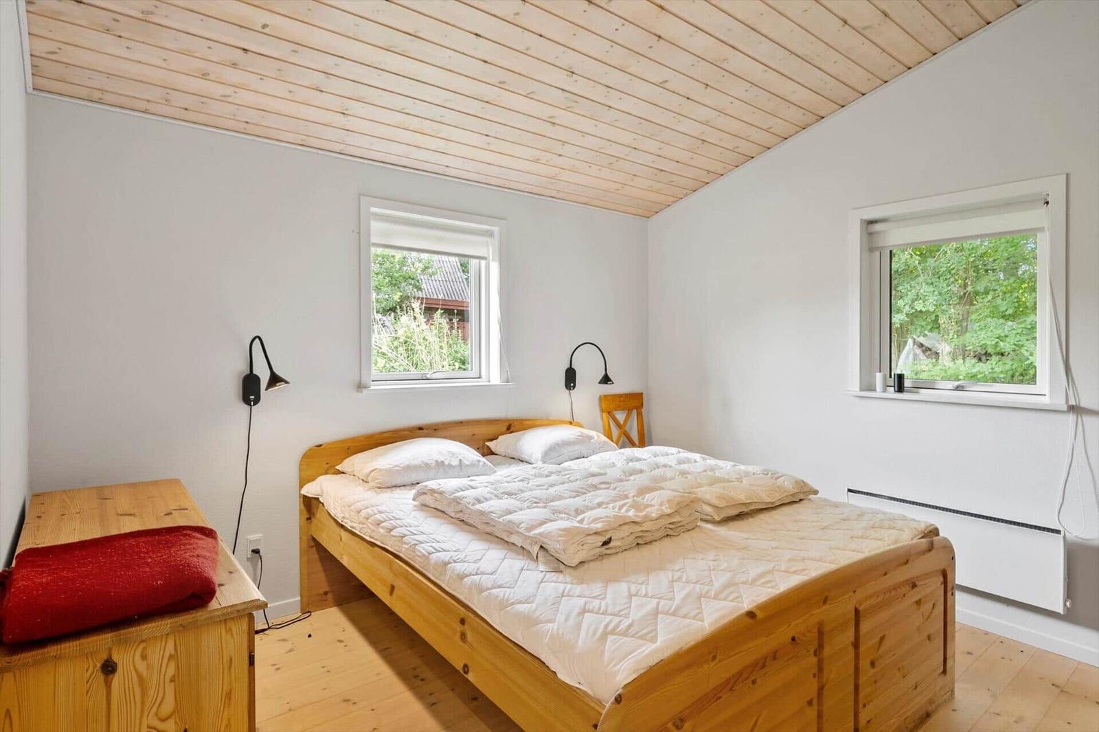 Apartment with two bedrooms, kitchen, and bathroom. Room layout with furniture specifications.