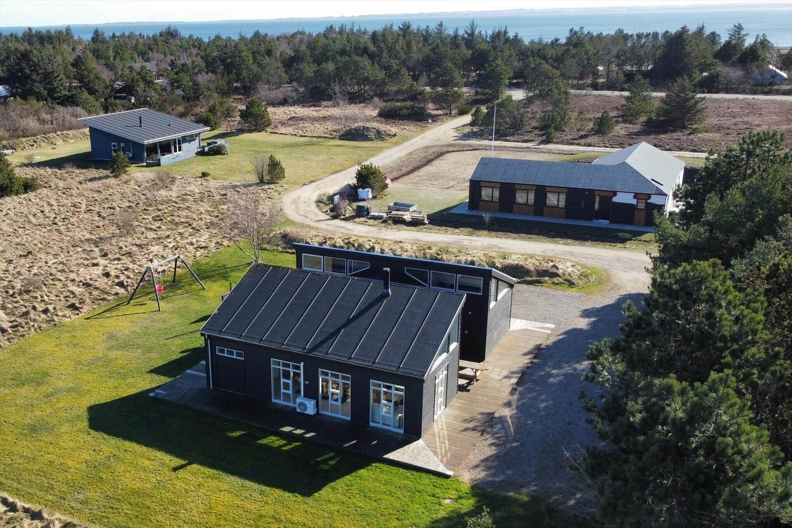 House with playground in rural area with fields and sea view.