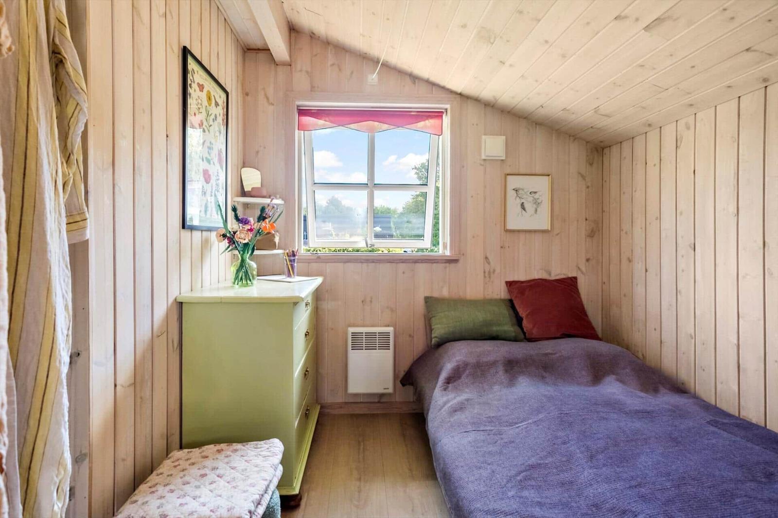 Erdgeschossplan mit Schlafzimmer und Zugang zum Garten