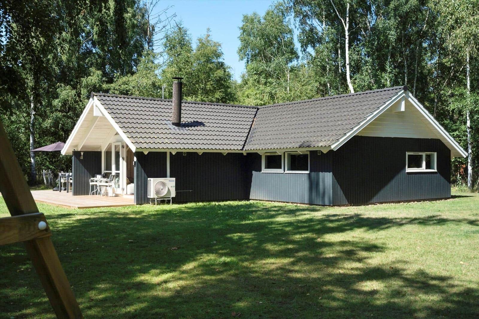 Apartment with three bedrooms, kitchen, and two bathrooms. Large living area with terrace.