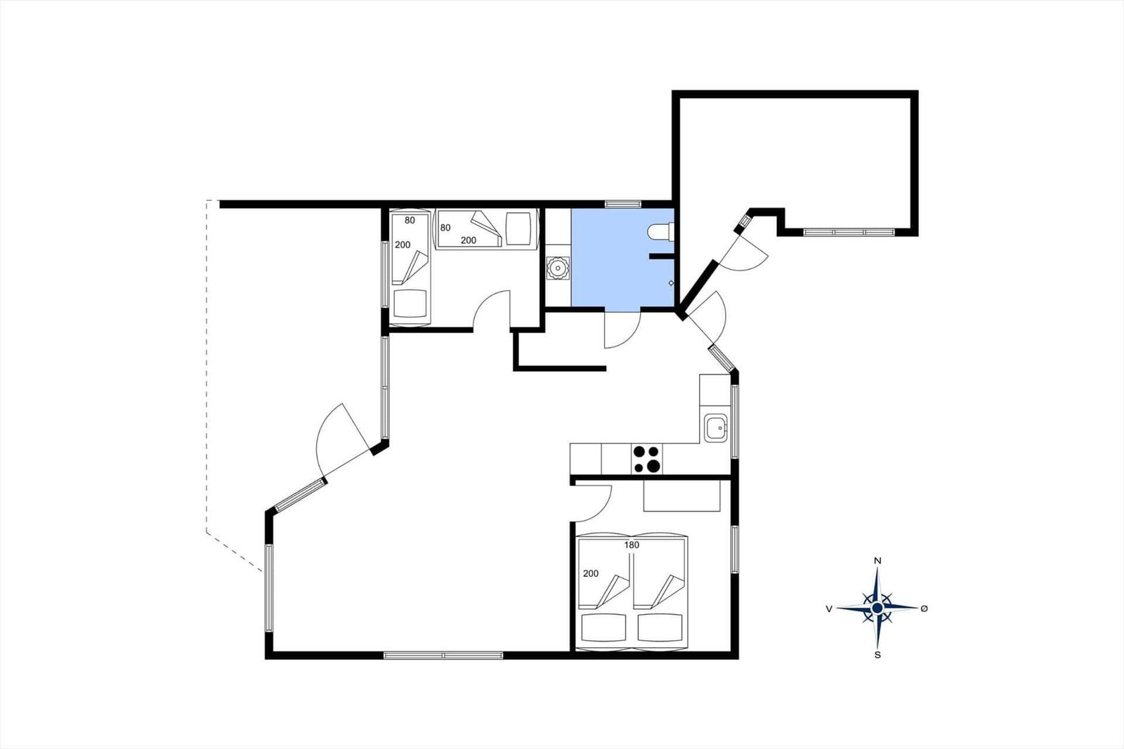 Living room with wood walls, sofa, bench, and table.