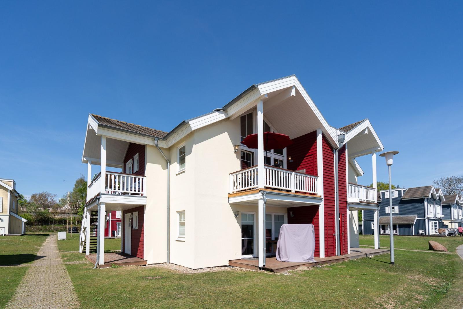 Grundriss von Doppeldrei mit Wohnzimmer, Küche, Sauna und Meerblick.