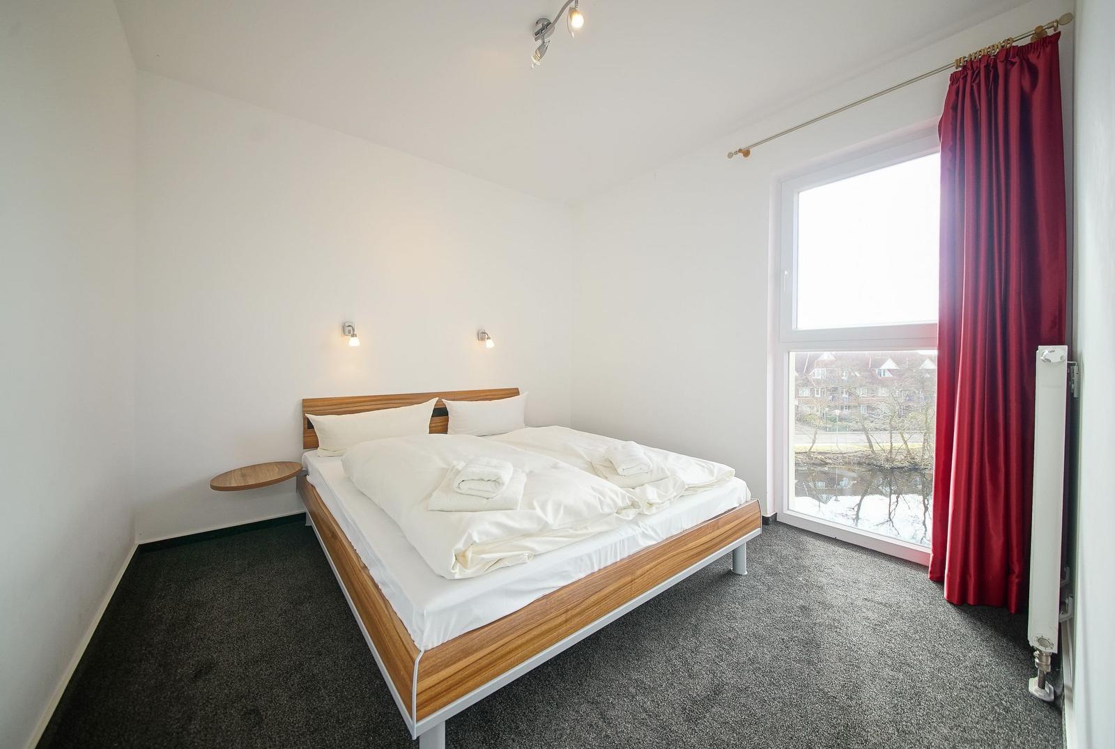 Schlafzimmer im sinf51-3-s, NordseeResort Friesland 51-3-S in Schillig