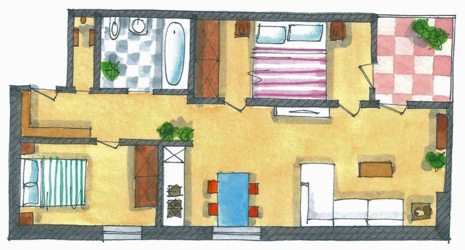 Dieses Apartment hat eine Küche, ein Bad, zwei Schlafzimmer und eine Wohnfläche mit Sofa und Tisch.