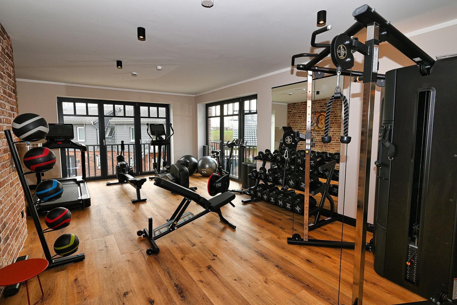 House with stairs, beverage cooler, and seating area on upper floor