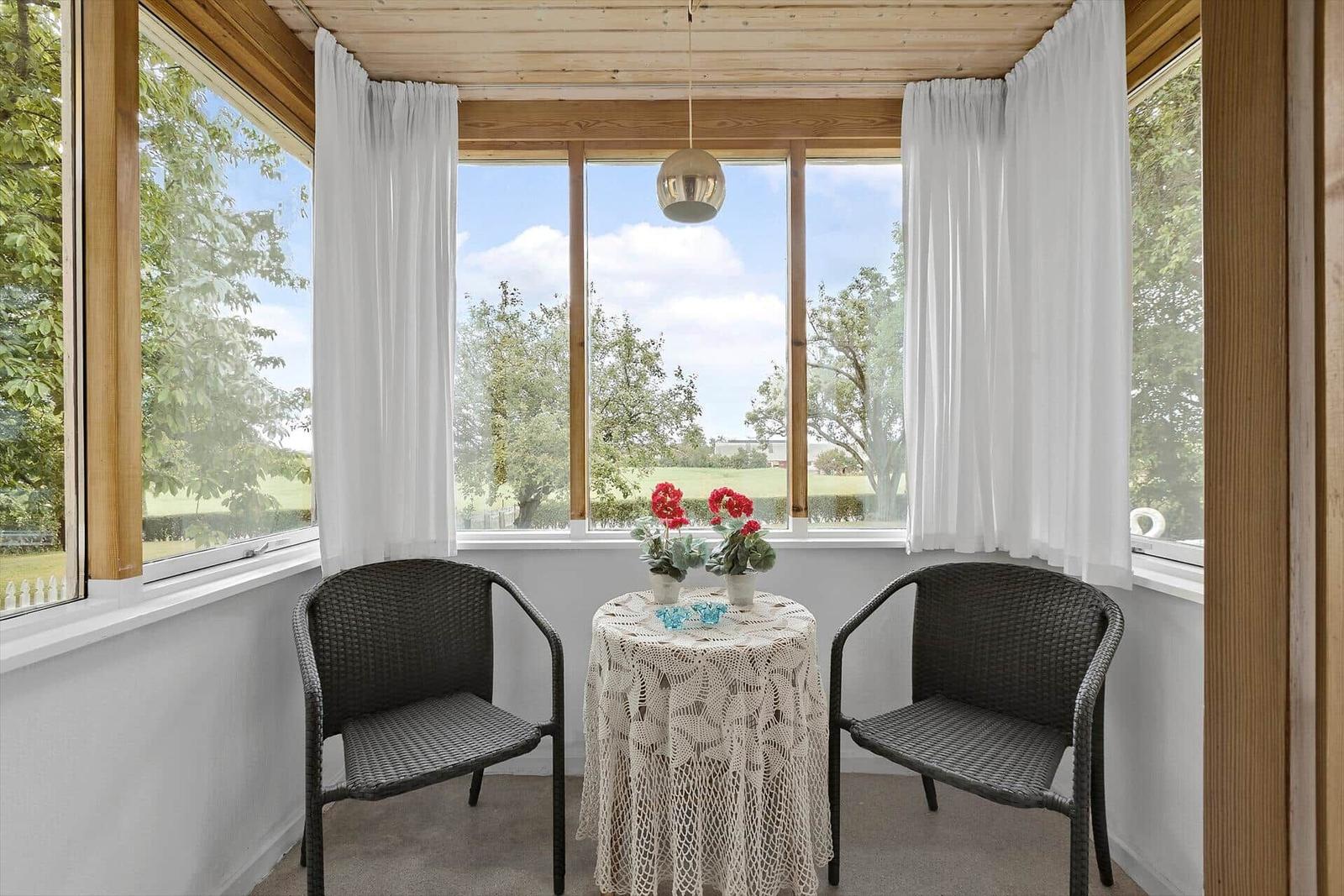 Kitchen with dining table, windows, and appliances