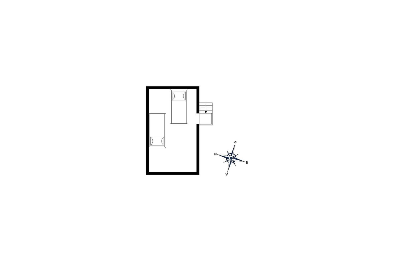 A bed with white bedding in a wood-paneled room with sloped ceilings and a window.