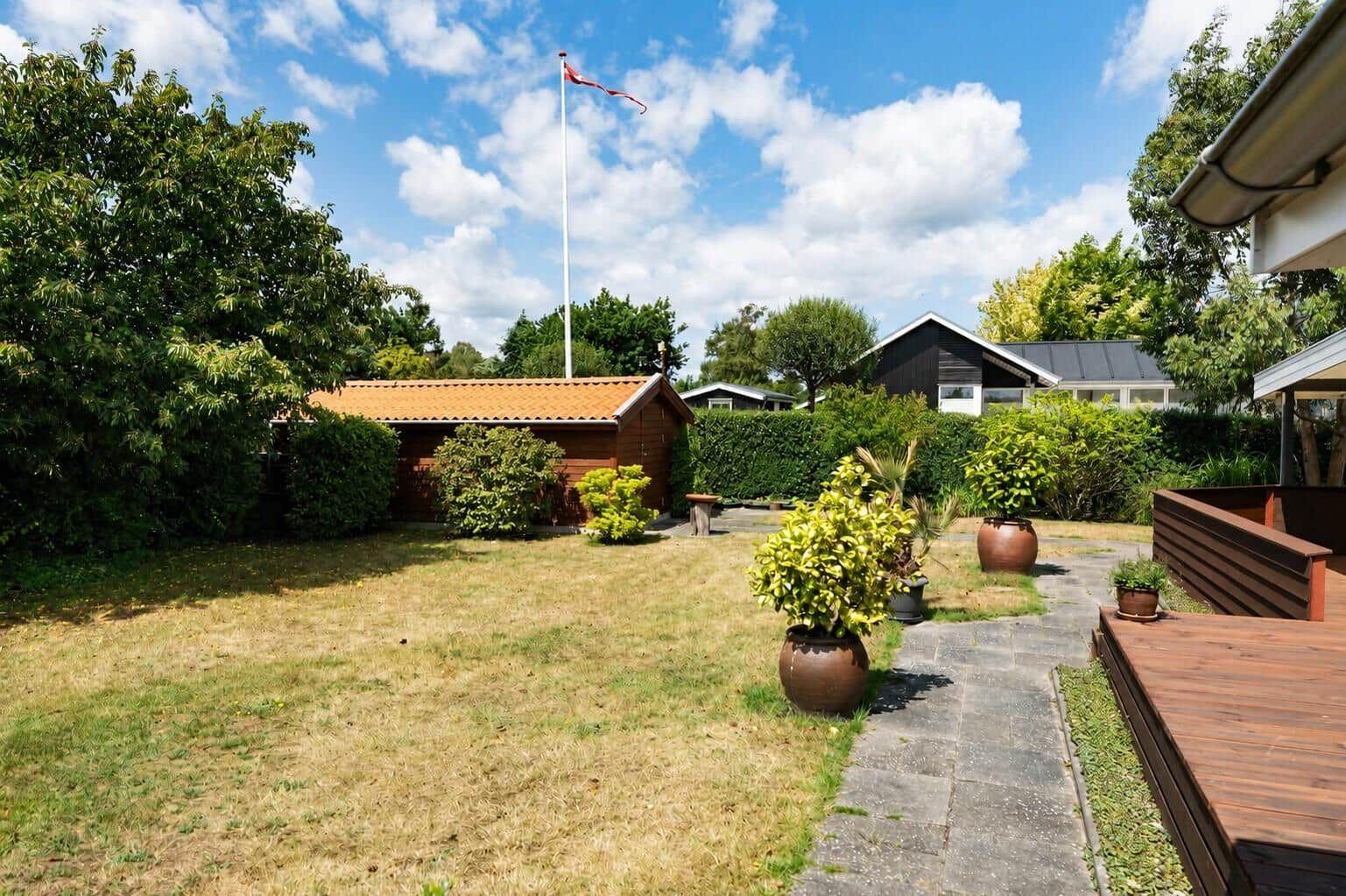 Modern villa with garden and barbecue area. House number 28. View of the property.