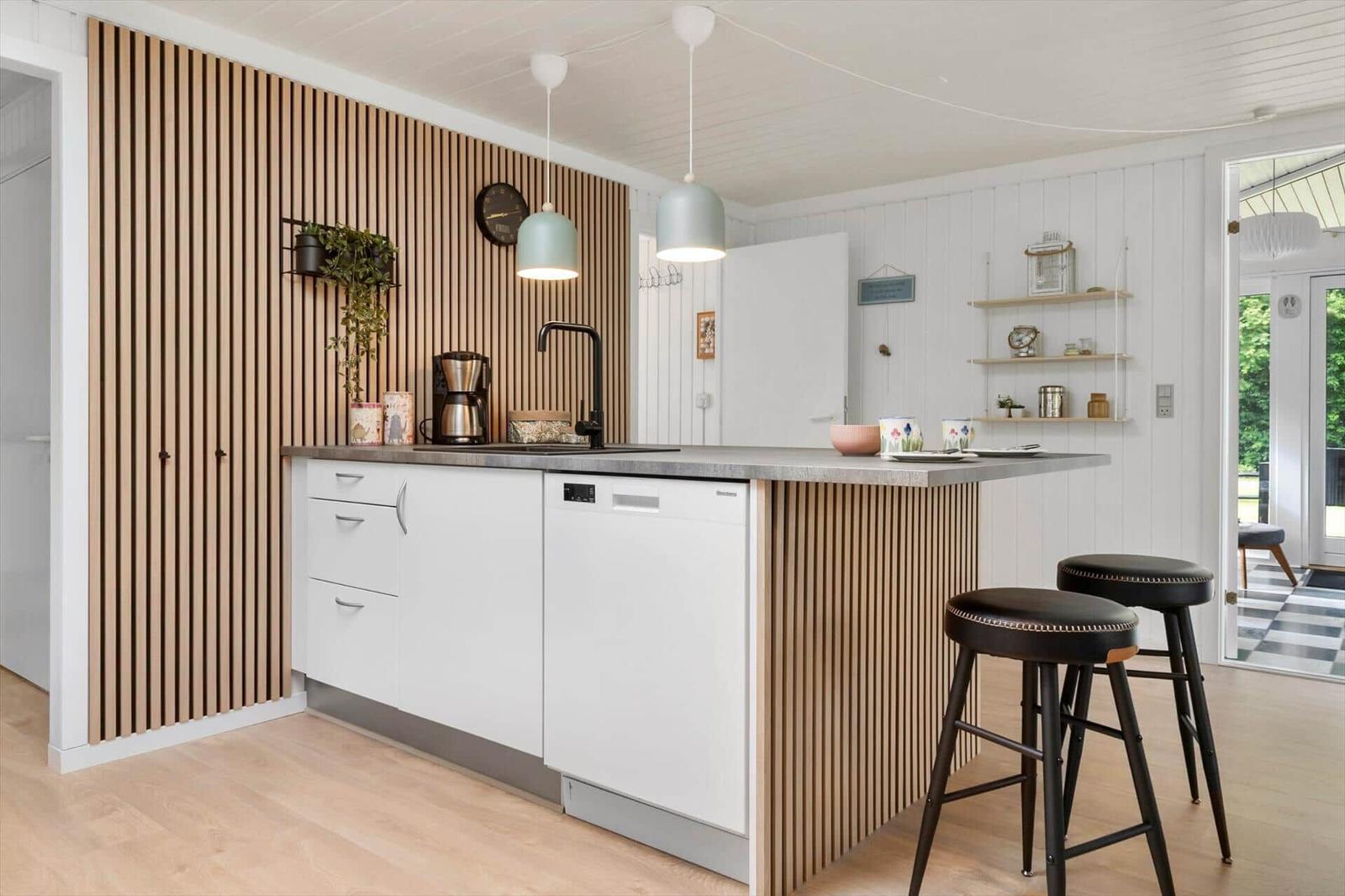 Dieses Grundriss zeigt eine Wohnung mit drei Schlafzimmern, Küche und Bad.