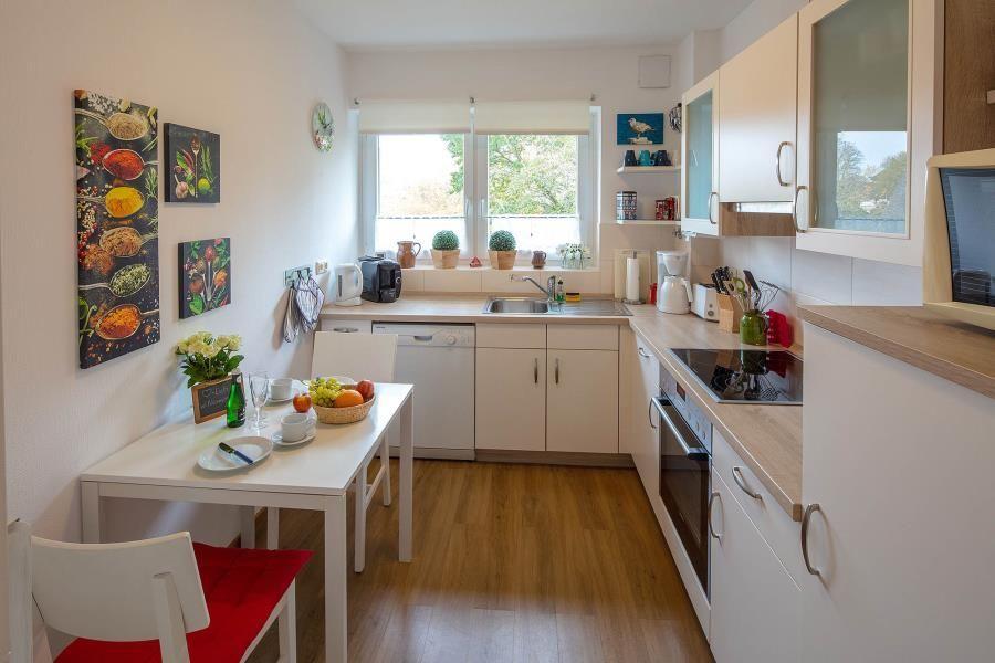 Kitchen with table and modern appliances