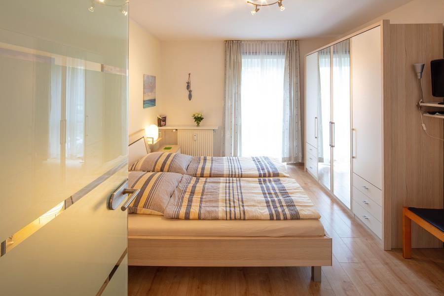 Bedroom with Two Beds and Wardrobe