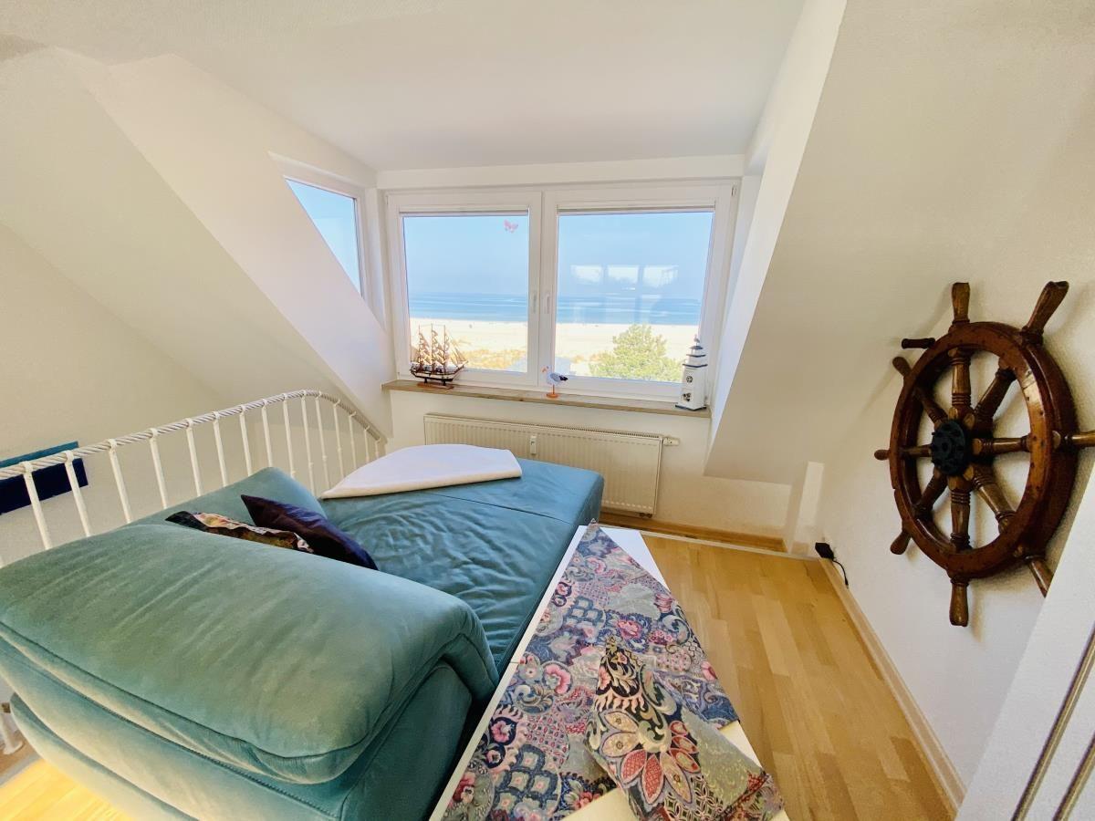 Haus mit Balkon, Meerblick und Treppenaufgang