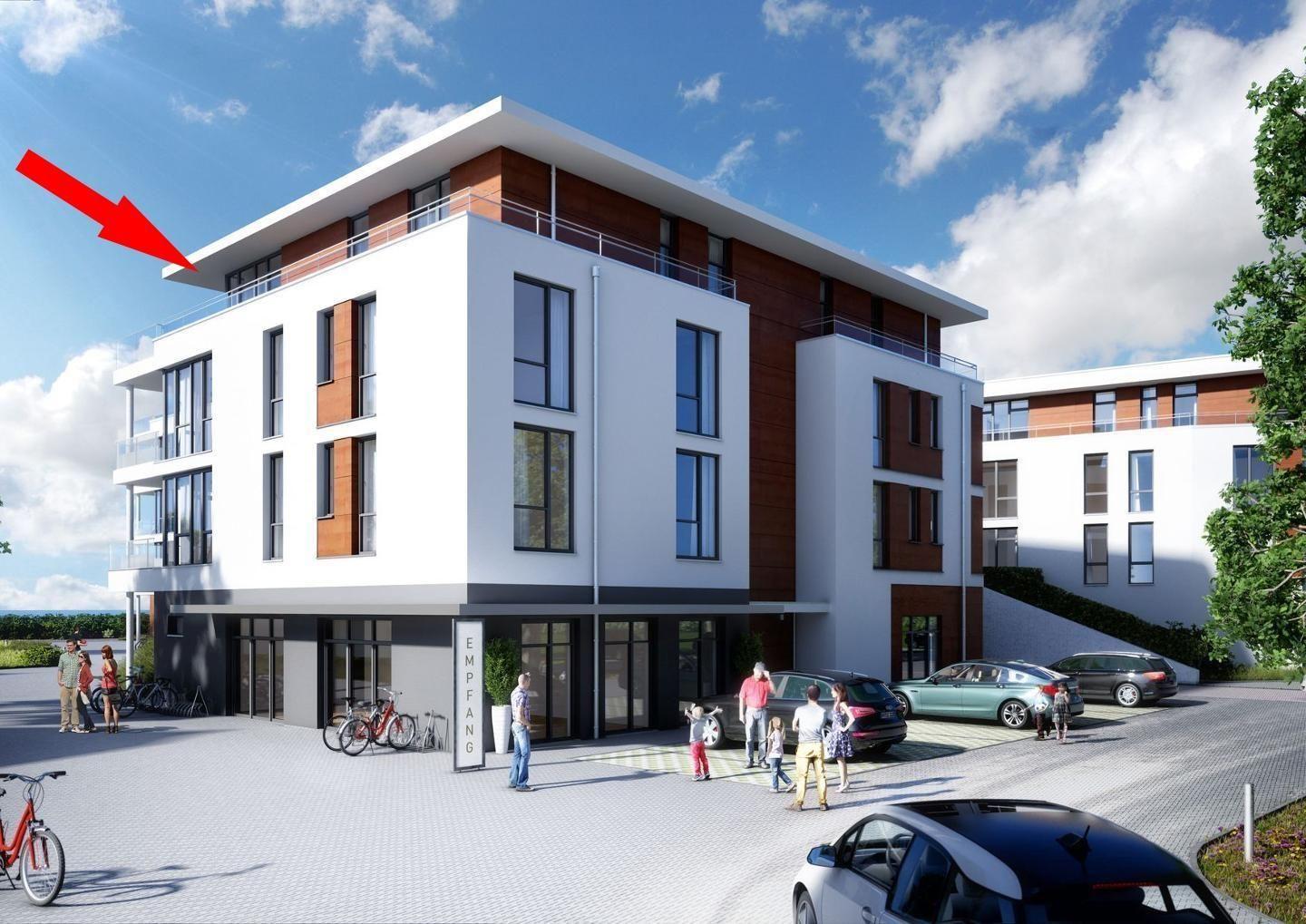 Moderne Wohnanlage mit Balkonen und Parkplatz. Empfangsgebäude mit Eingang.