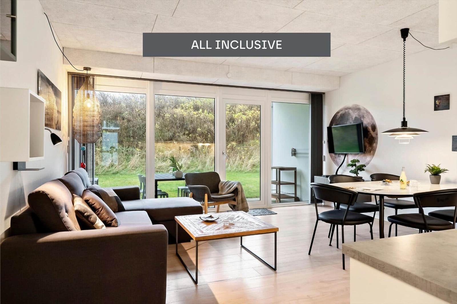 Apartment with bedroom, kitchen, and covered terrace.