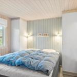 Bedroom with bed, window, and closets