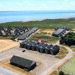 Holiday homes near the coast with parking and sports courts.
