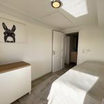 Bedroom with bed, cabinet, and wall art of a donkey.