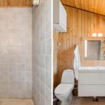 Bad mit Dusche und Waschbecken, Holzwand und Spiegel