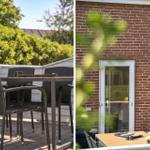 Terrasse mit Tisch und Stühlen, rote Ziegelwand und Glastür