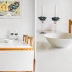 Esszimmer mit weißem Tisch, Holzstühlen und einer weißen Schale.