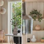 Wohnbereich mit Holzwand, Pflanzen und Dekor. Regal mit Vasen und Pflanzen.