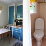 Küche mit blauen Schränken und Esstisch. Nebenraum mit Toilette und Waschbecken.