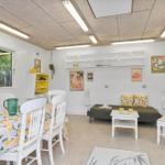 Dining area with table and chairs. Living area with sofa and table.