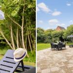 Terrace with lounge chairs, parasol, and grill area in the garden.