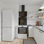 Kitchen with refrigerator, stove, and sink. White cabinets and countertop.