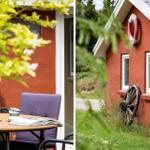 Roter Holzhaus mit Außentisch und Stuhl, Rettungsring und altes Rad an der Wand.