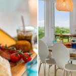 Tisch mit Speisen und Wein, Fensterblick auf Grün, hängende Lampen