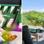 Backgammon-Spiel auf Tisch mit Blick auf grüne Landschaft