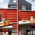 Terrasse mit Tisch, Stühlen und Pflanzen vor roter Holzabtrennung.