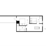 Geschossplan zeigt Wohn- und Schlafbereich mit Bad und Treppe.