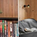 Bett mit geöffnetem Buch und Wandlampe. Bücherregal mit Pflanze.