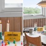 Tisch mit Ludo-Spiel, Teekisten und brennenden Kerzen vor Fenster.