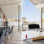 Terrasse mit Tisch, Stühlen, Grill und Brettspielen für gemütliche Stunden.