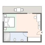 Dieses Apartment hat ein Schlafzimmer, eine Küche, ein Bad und einen Fernseher.