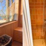 Sauna mit Blick auf See und Boot. Duschbereich mit orangefarbenen Fliesen.