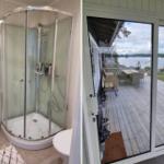 Dusche mit Glaswand und Balkon mit Blick auf See.