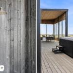 Dusche an Holzwand und Terrasse mit Whirlpool und Sitzgelegenheit.