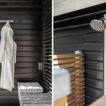 Außen-Dusche mit Duschbrause und weiße Bademantel an Haken hängend