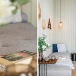 Ein Wohnbereich mit Sofa, Kamin und Tisch mit Blumen.