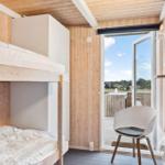 Room with bunk bed and view of terrace