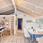Kitchen with dining area and bedroom under roof