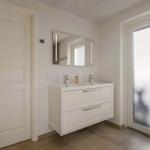 Bathroom with sink, mirror and door